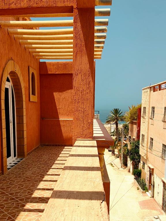 Outdoor relaxation area with surf board storage